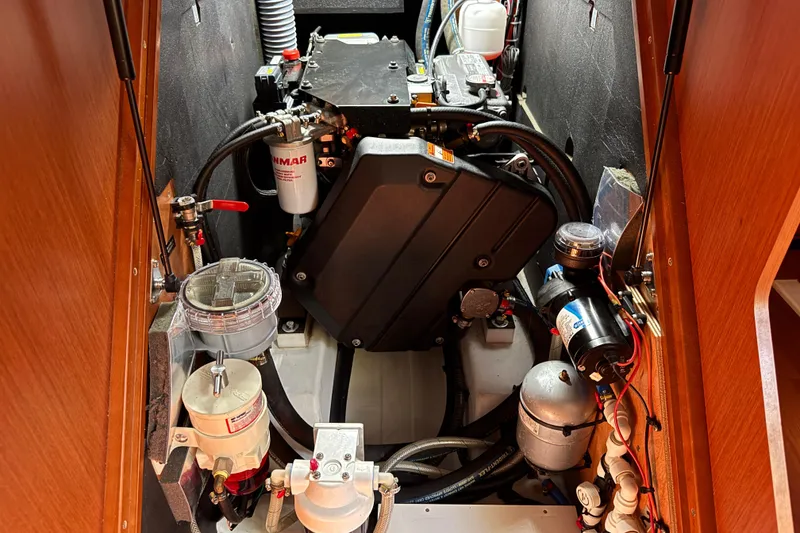 Slide: The Image of Engine compartment of a 2019 Beneteau Oceanis 41.1 sailboat, showcasing mechanical components. - 11