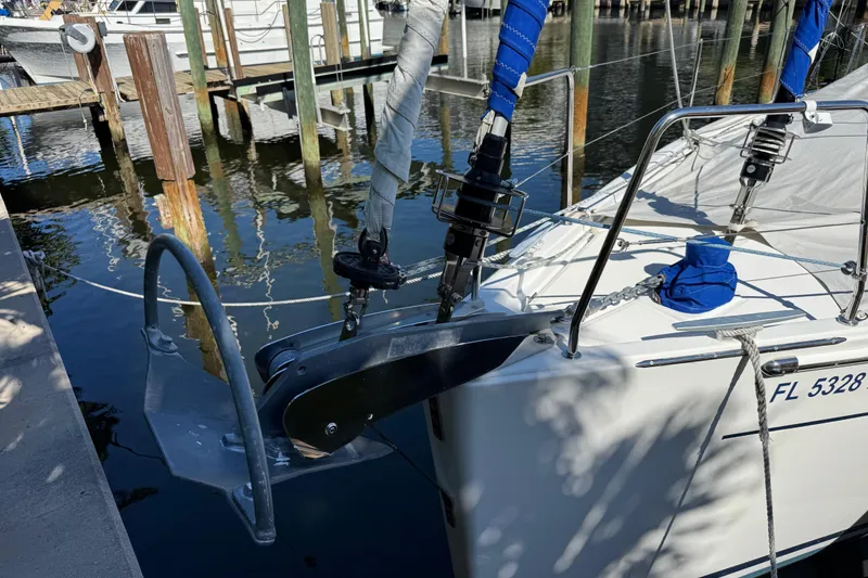 Slide: The Image of 2019 Beneteau Oceanis 41.1 sailboat docked, showing anchor and bow details. - 2