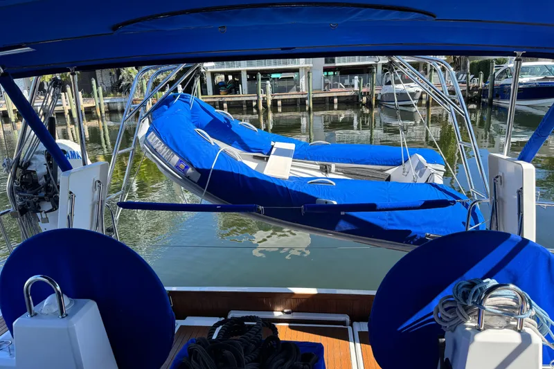 Slide: The Image of Beneteau Oceanis 41.1 sailboat with blue covers, docked in a marina, 2019 model. - 3