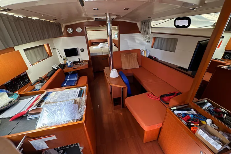 Slide: The Image of Interior of 2019 Beneteau Oceanis 41.1 yacht with cozy seating and navigation equipment. - 7