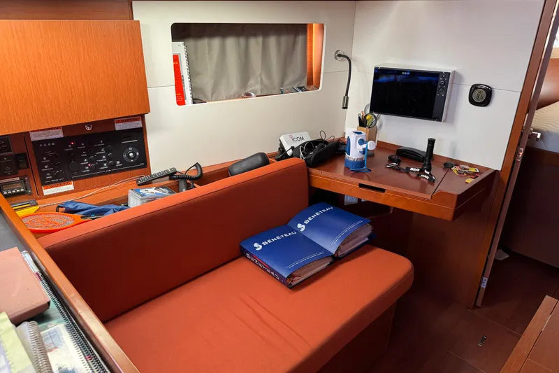 Slide: The Image of Interior of 2019 Beneteau Oceanis 41.1 yacht with navigation equipment and manuals. - 9