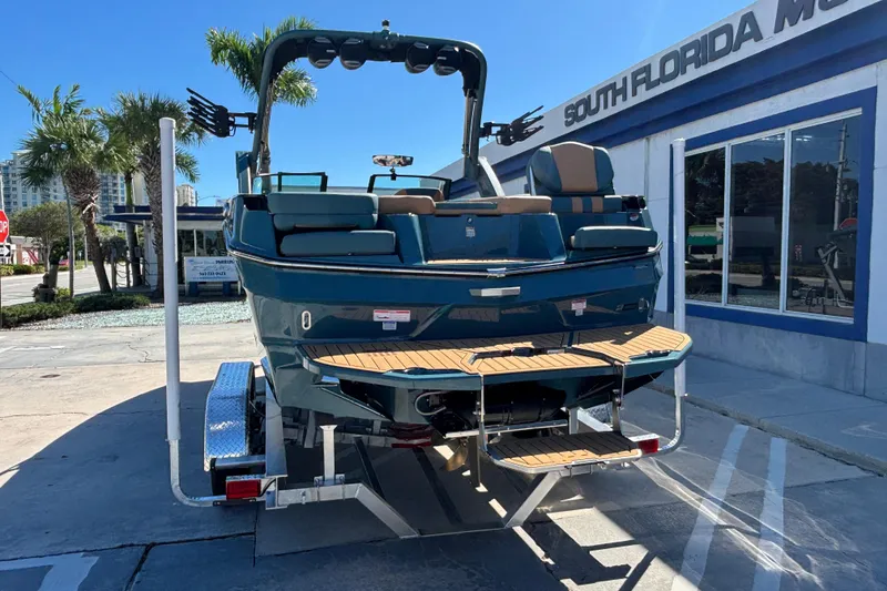 Slide: The Image of 2026 MasterCraft XT24 boat on trailer at South Florida dealership. - 3