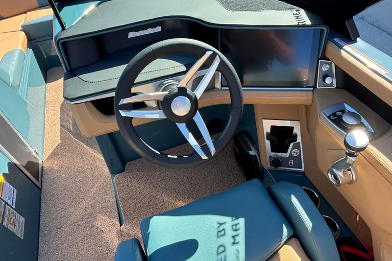 Slide: The Image of 2026 MasterCraft XT24 boat interior with modern steering wheel and dashboard controls. - 5