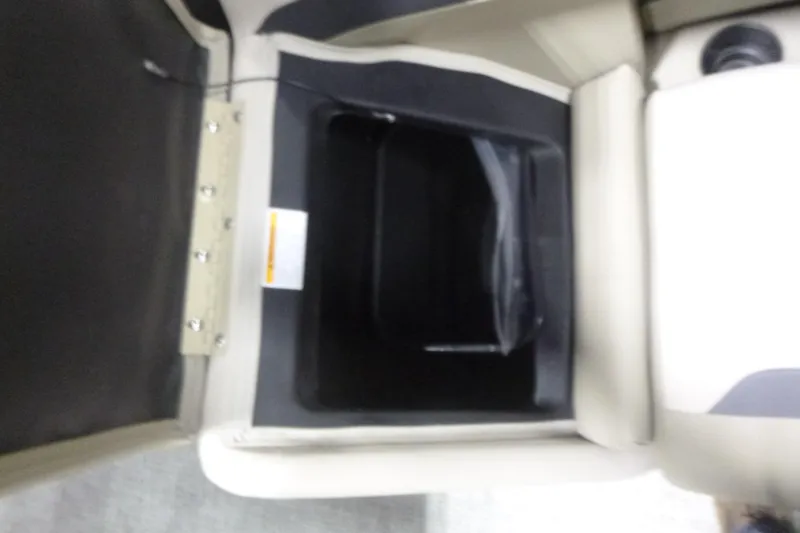 Slide: The Image of Open storage compartment in 2026 Premier 220 Sunscape RF boat interior. - 12