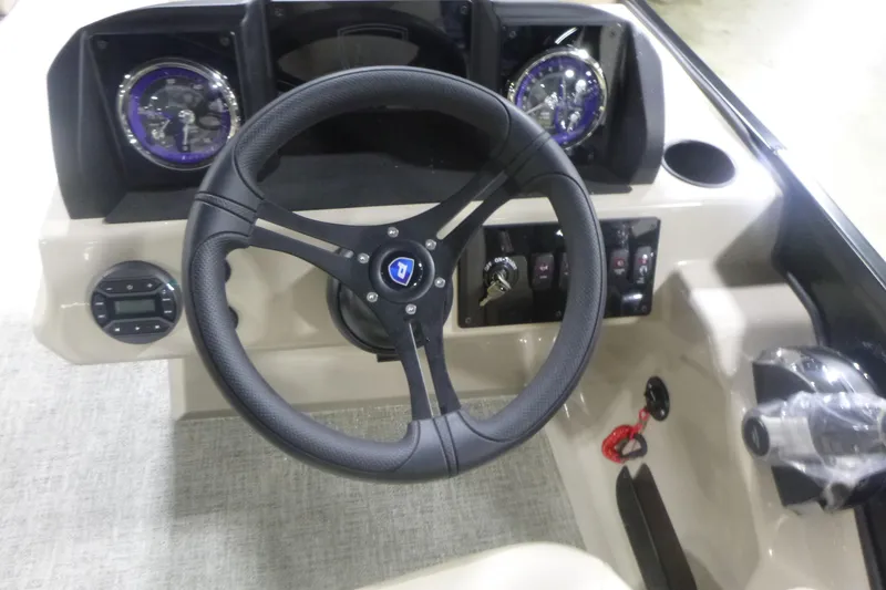 Slide: The Image of Steering console of 2026 Premier 220 Sunscape RF boat with gauges and controls. - 15