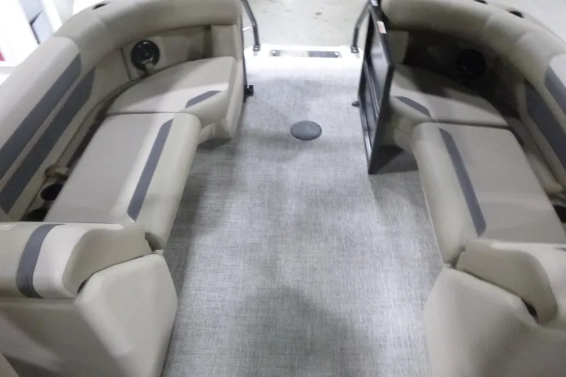 Slide: The Image of Interior of 2026 Premier 220 Sunscape RF boat with beige seating and gray flooring. - 17