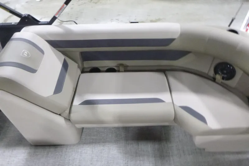 Slide: The Image of 2026 Premier 220 Sunscape RF boat interior seating, featuring beige and gray upholstery. - 19