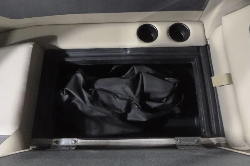 Slide: The Image of Storage compartment in 2026 Premier 220 Sunscape RF boat with cup holders. - 21