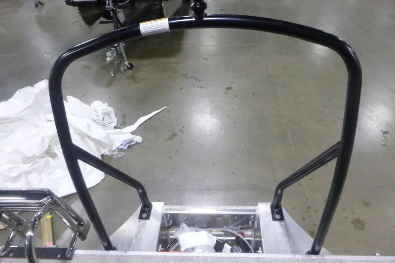 Slide: The Image of Rear view of 2026 Premier 220 Sunscape RF boat ladder on a concrete floor. - 22