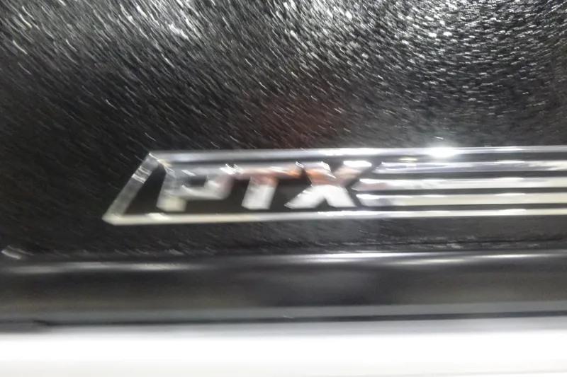 Slide: The Image of PTX emblem on 2026 Premier 220 Sunscape RF boat, black textured background. - 23