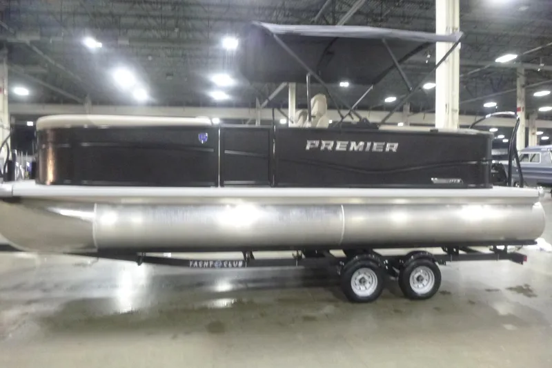 Slide: The Image of 2026 Premier 220 Sunscape RF pontoon boat on trailer in indoor showroom. - 4