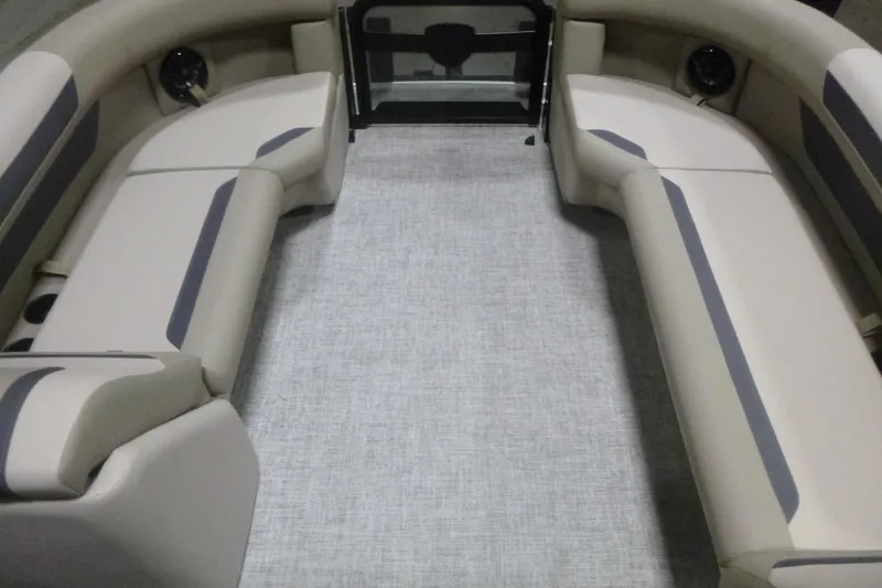 Slide: The Image of 2026 Premier 220 Sunscape RF boat interior with beige seating and gray accents. - 7