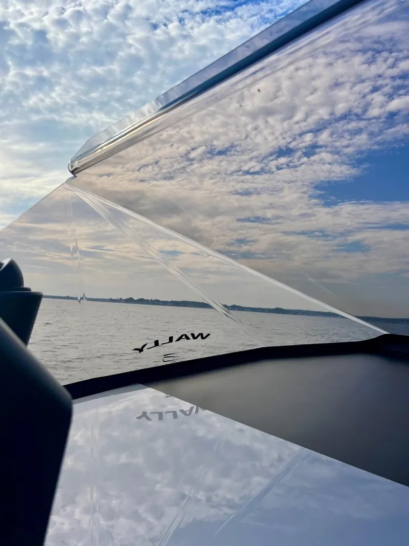 Slide: The Image of Wally 48 X yacht on open water under a partly cloudy sky, 2023 model. - 19