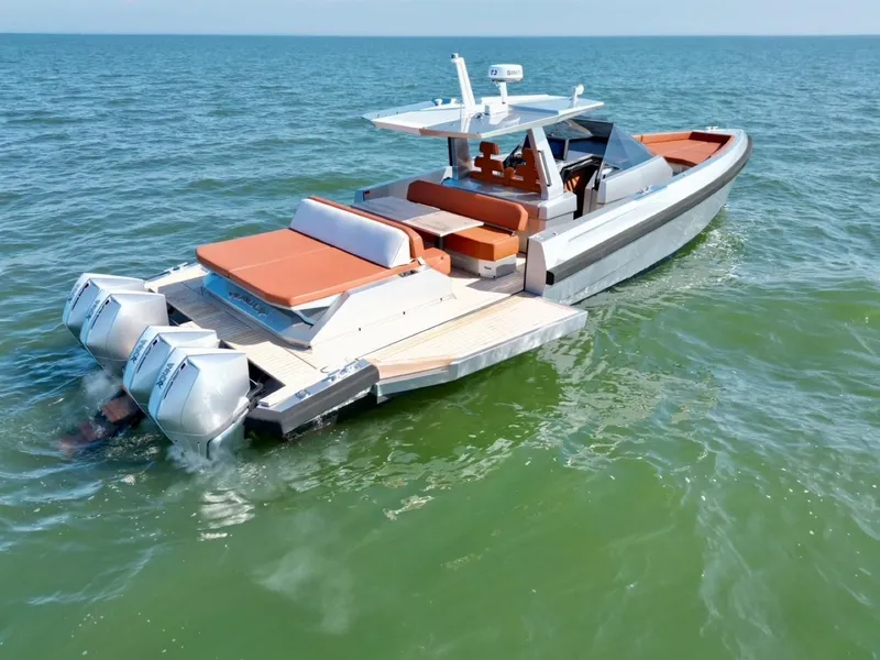 Slide: The Image of 2023 Wally 48 X luxury yacht cruising on open water. - 2