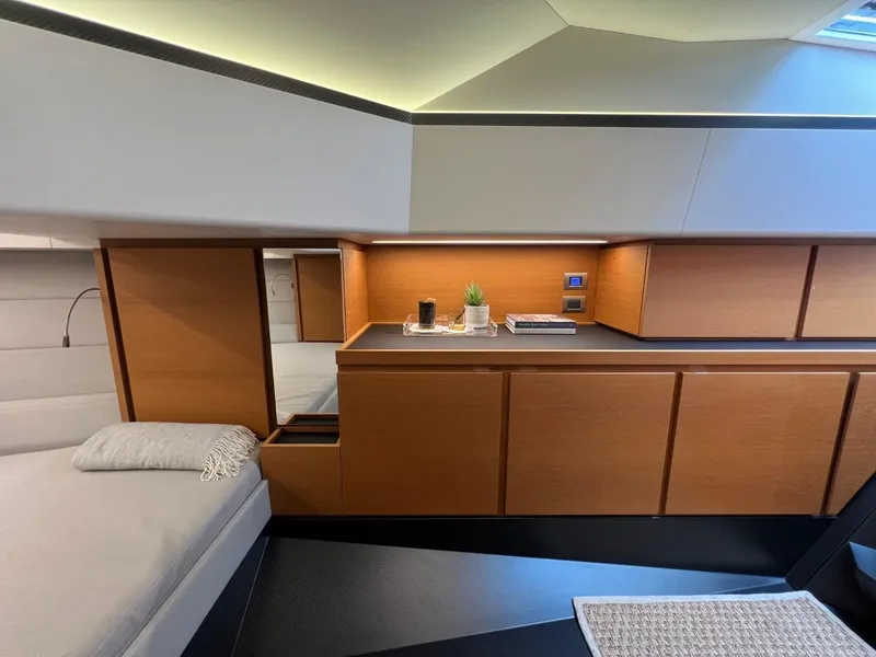 Slide: The Image of Luxurious interior of 2023 Wally 48 X yacht with modern wood cabinetry and cozy bed. - 34