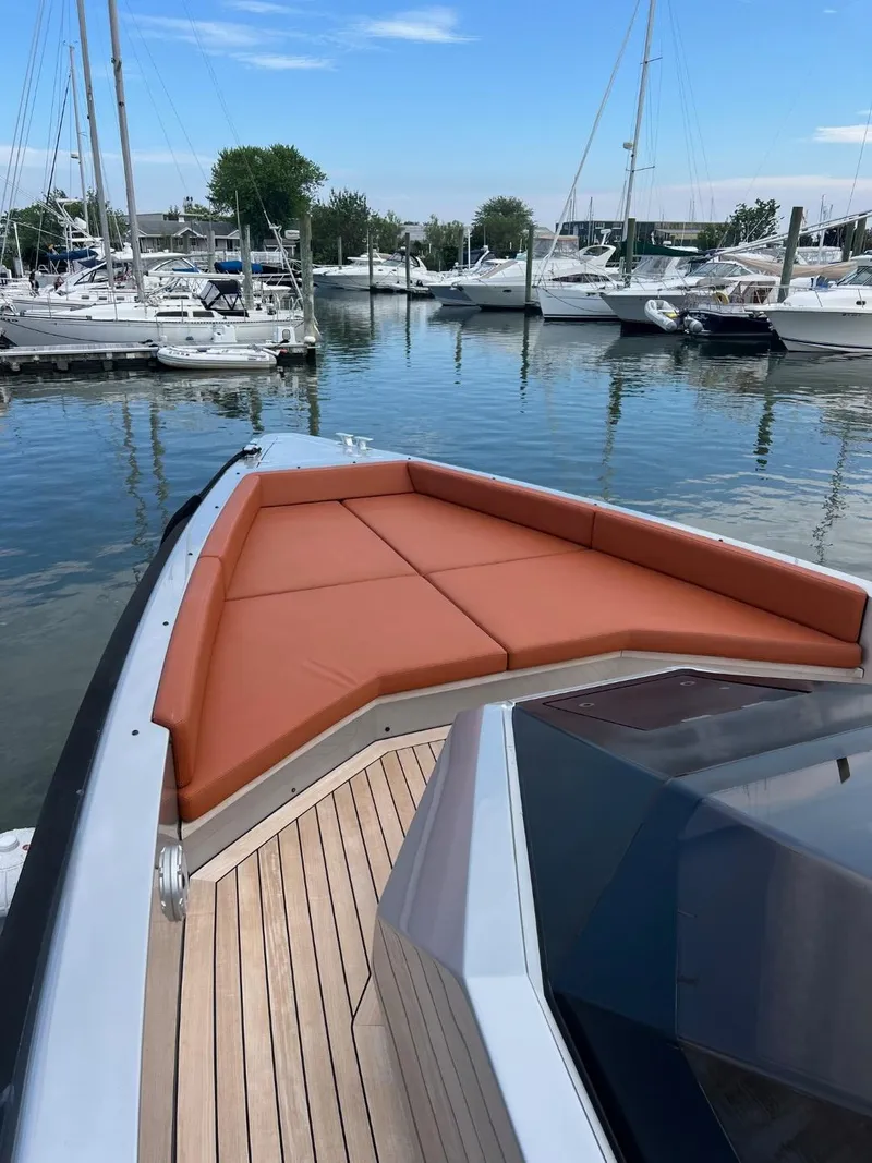 Slide: The Image of Luxury Wally 48 X yacht with cushioned deck, docked in marina, 2023 model. - 38