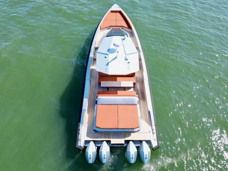 Slide: The Image of 2023 Wally 48 X luxury yacht on calm green water, aerial view. - 10