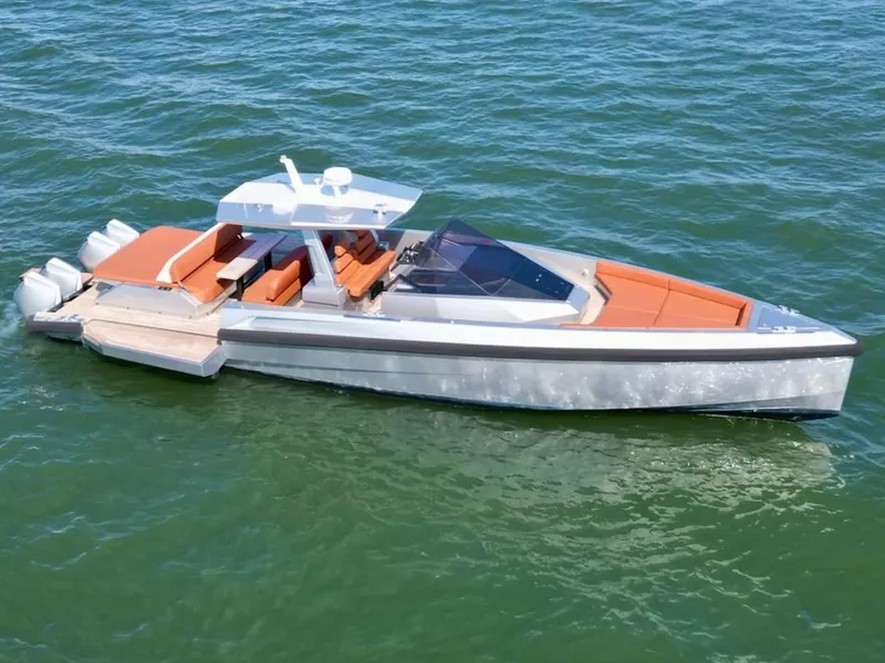Slide: The Image of 2023 Wally 48 X luxury yacht with sleek design and orange seating on open water. - 16