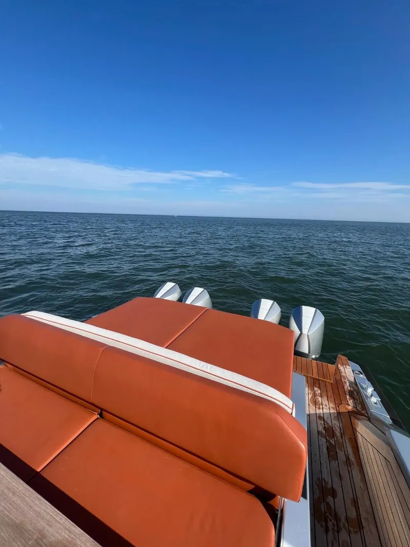 Slide: The Image of Luxury Wally 48 X yacht with leather seating, ocean view, and clear blue sky. - 26