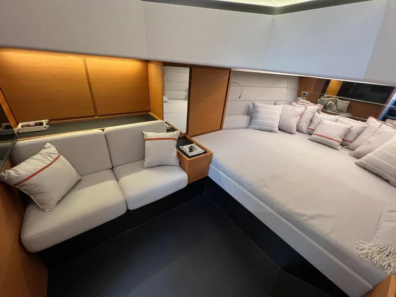 Slide: The Image of Luxurious interior of 2023 Wally 48 X yacht with modern seating and plush bedding. - 30