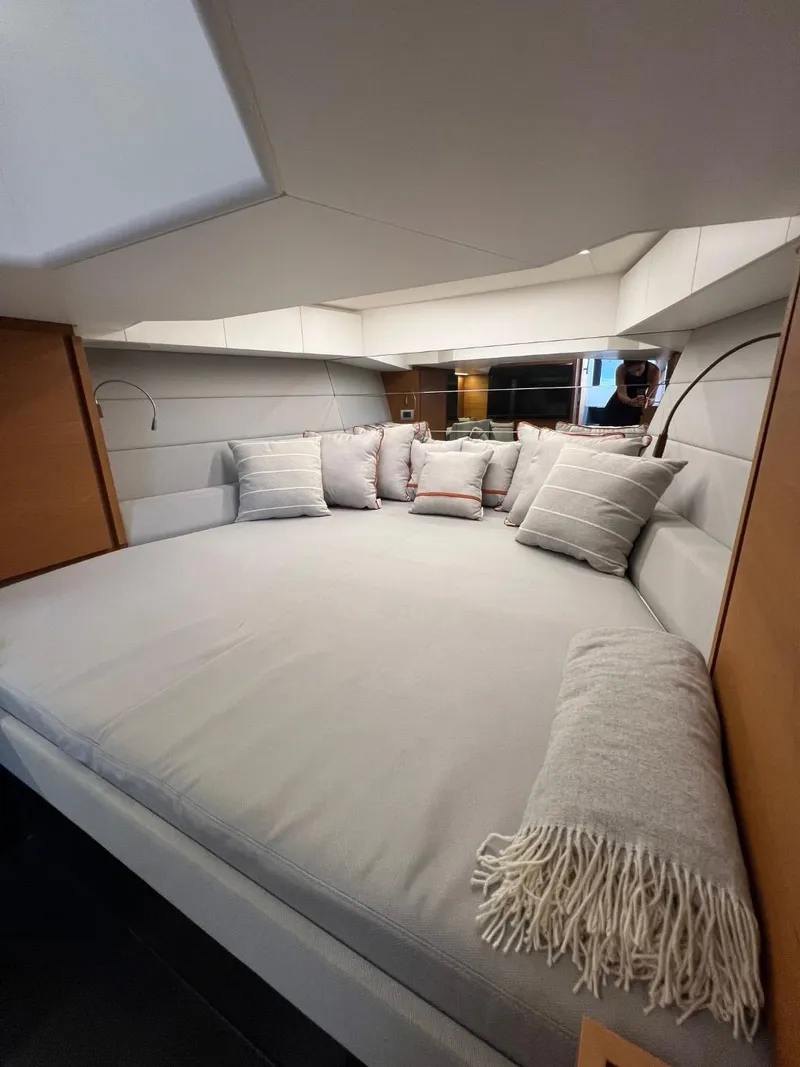 Slide: The Image of Luxurious interior cabin of 2023 Wally 48 X yacht with plush bedding and cushions. - 33