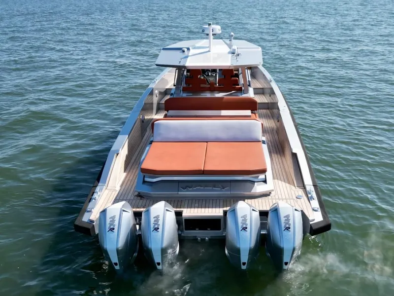 Slide: The Image of 2023 Wally 48 X luxury yacht with four powerful outboard engines on open water. - 9