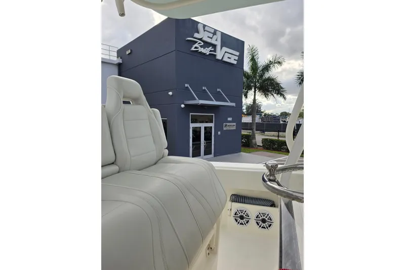 Slide: The Image of 2022 SeaVee 340Z boat interior with SeaVee Boats building in the background. - 17