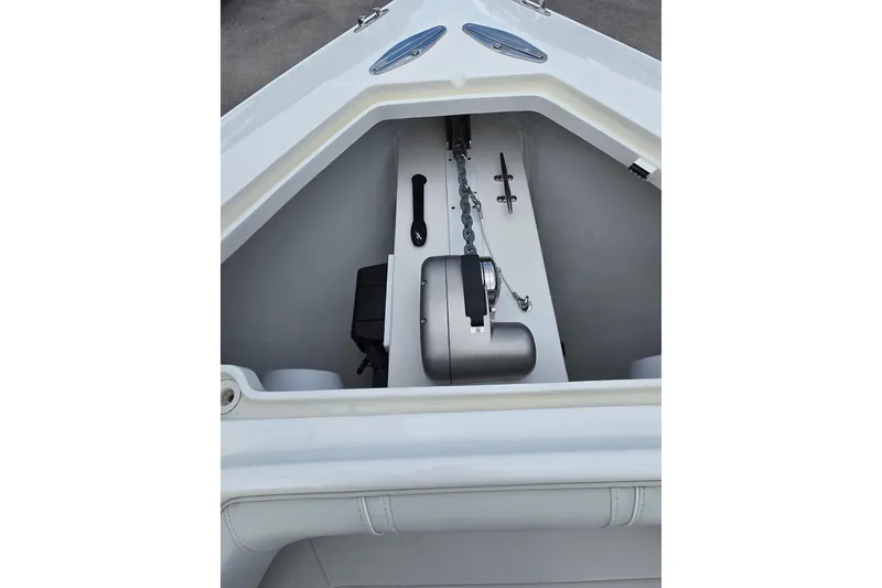 Slide: The Image of 2022 SeaVee 340Z boat anchor compartment with chain and winch. - 21
