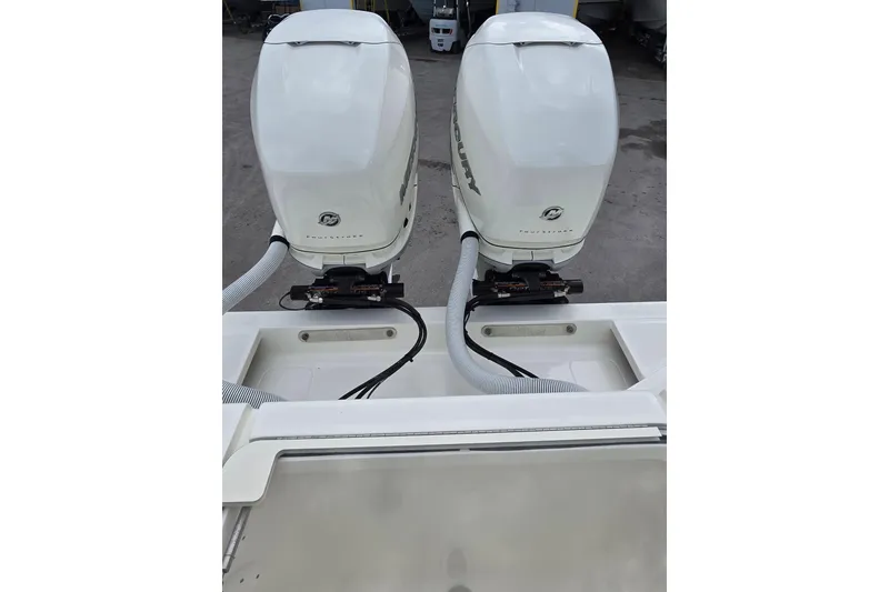 Slide: The Image of 2022 SeaVee 340Z boat with dual Mercury outboard engines, rear view. - 22