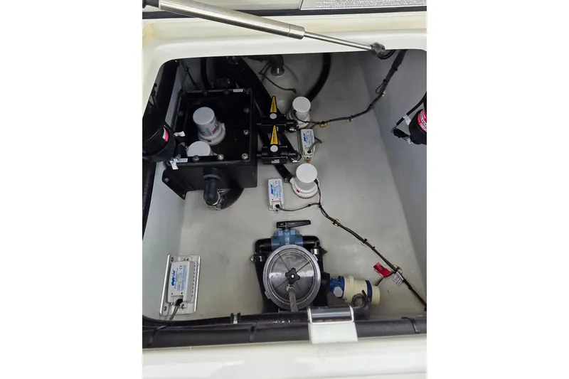 Slide: The Image of 2022 SeaVee 340Z boat compartment showcasing mechanical components and wiring. - 26