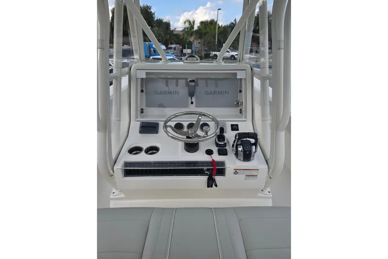 Slide: The Image of 2022 SeaVee 340Z boat console with Garmin navigation system and steering wheel. - 5