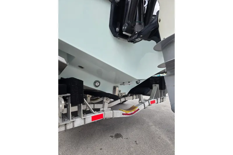 Slide: The Image of 2022 SeaVee 340Z boat on trailer, showing hull and outboard motor components. - 6