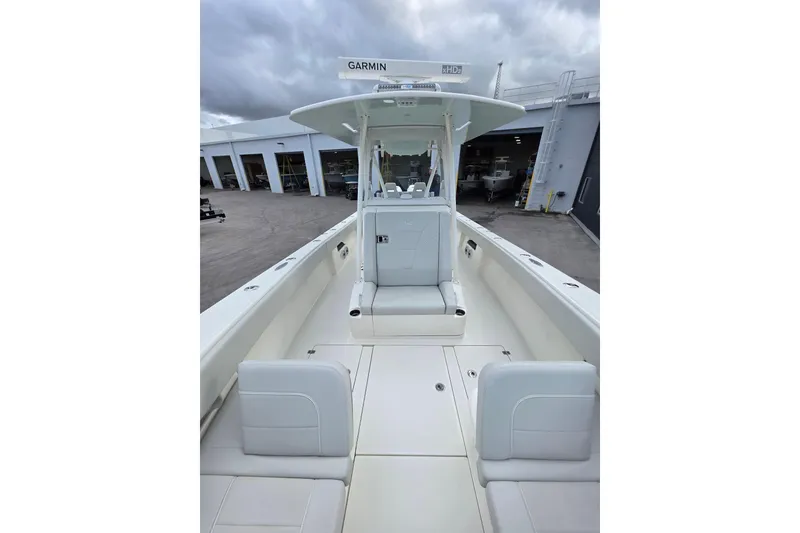 Slide: The Image of 2022 SeaVee 340Z boat interior with white seating and Garmin equipment. - 9
