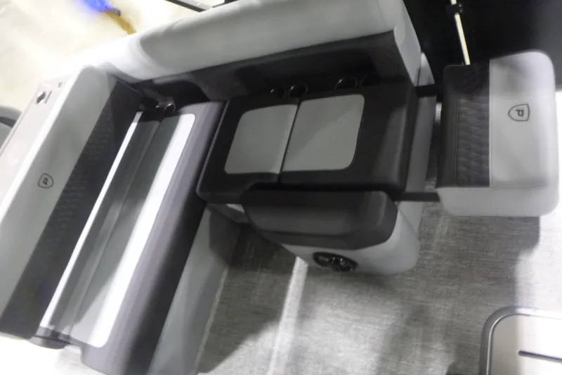 Slide: The Image of 2026 Premier 230 Sunsation RS boat interior seating with modern design and cup holders. - 13