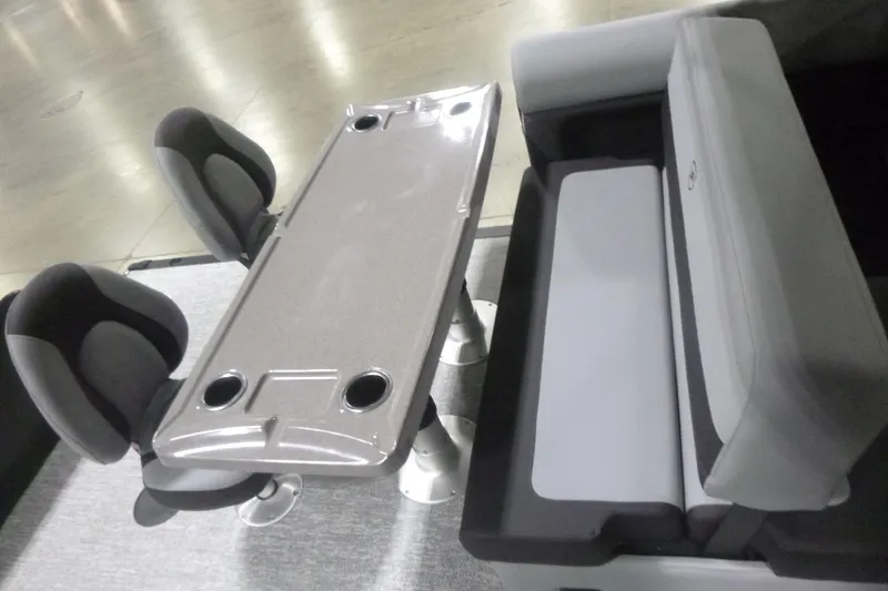 Slide: The Image of Interior seating of 2026 Premier 230 Sunsation RS boat with table and cup holders. - 16