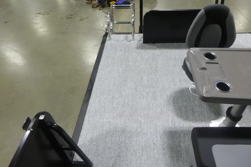 Slide: The Image of Interior of 2026 Premier 230 Sunsation RS pontoon boat with seating and table. - 19
