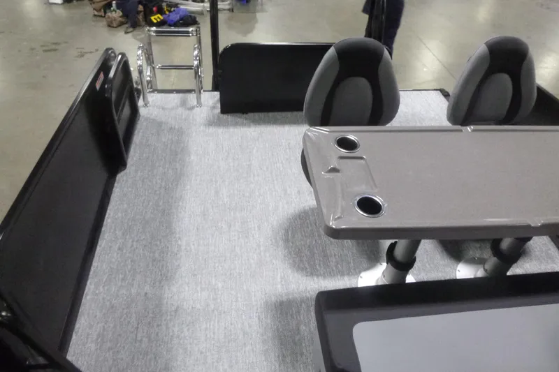 Slide: The Image of Interior of 2026 Premier 230 Sunsation RS pontoon boat with seating and table. - 20