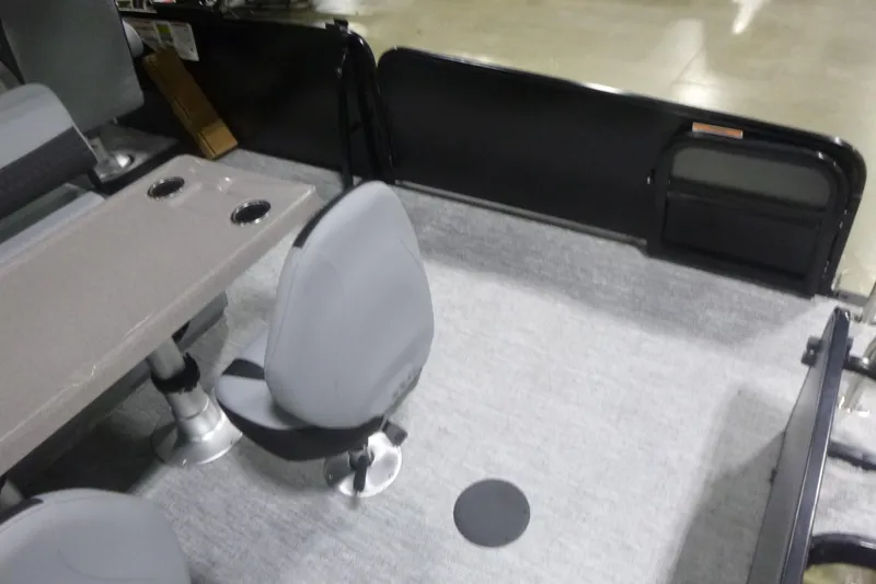 Slide: The Image of Interior of 2026 Premier 230 Sunsation RS pontoon boat with seating and table. - 21