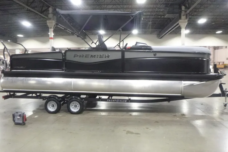 Slide: The Image of 2026 Premier 230 Sunsation RS pontoon boat on trailer in indoor showroom. - 4