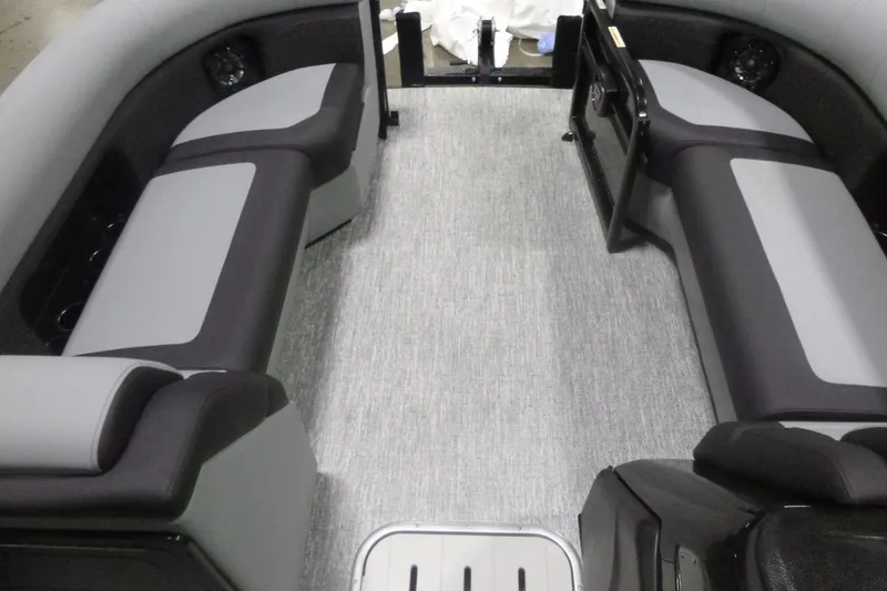 Slide: The Image of Interior of 2026 Premier 230 Sunsation RS pontoon boat with gray seating and flooring. - 7