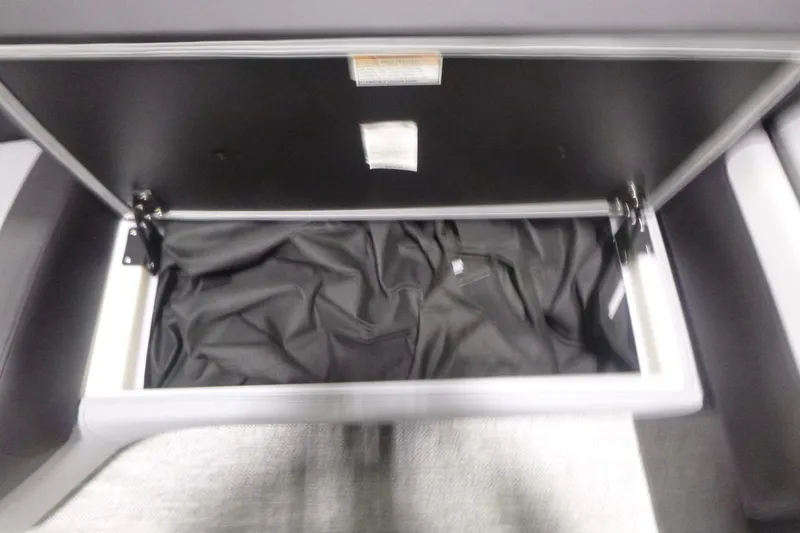 Slide: The Image of Open storage compartment in 2026 Premier 230 Sunsation RS boat. - 9