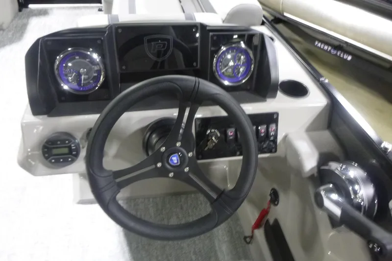 Slide: The Image of 2026 Premier 200 Sunscape RF boat dashboard with steering wheel and gauges. - 14