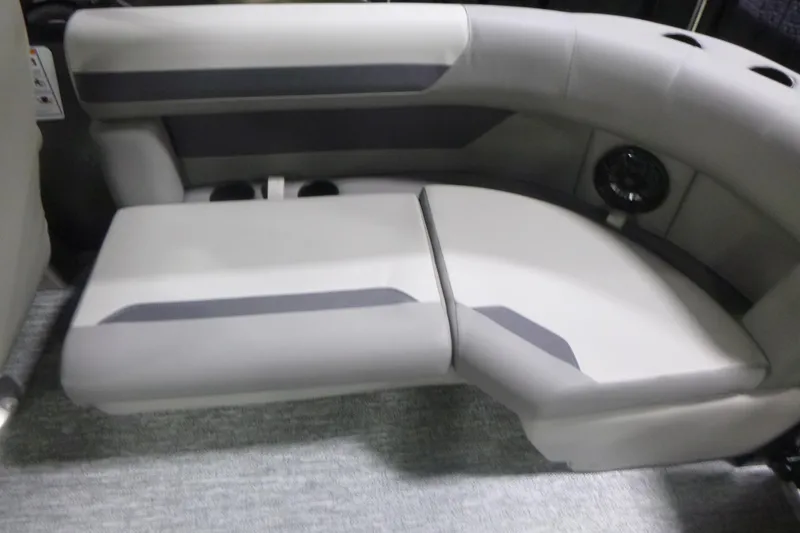 Slide: The Image of 2026 Premier 200 Sunscape RF boat interior seating with gray upholstery and cup holders. - 19