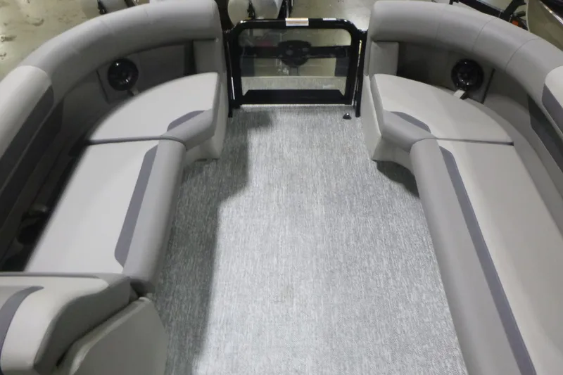Slide: The Image of 2026 Premier 200 Sunscape RF boat interior with gray seating and carpet flooring. - 7
