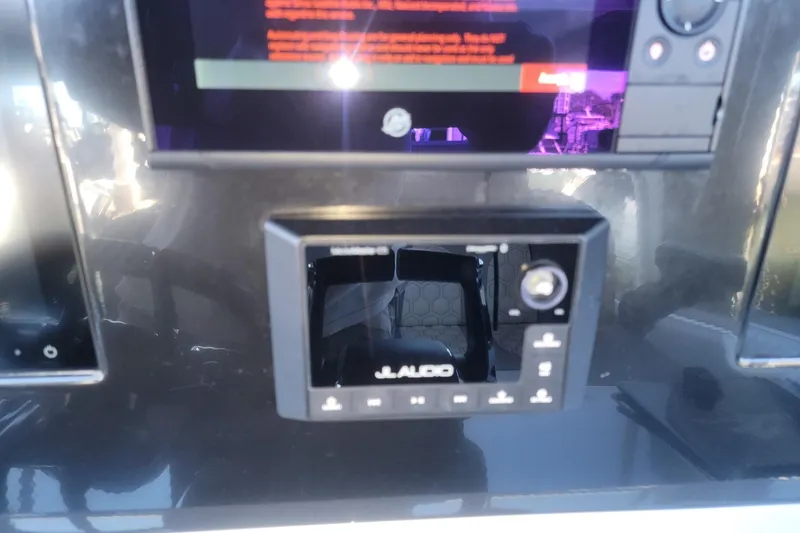 Slide: The Image of Control panel of 2024 Statement 350 Open with JL Audio system. - 13