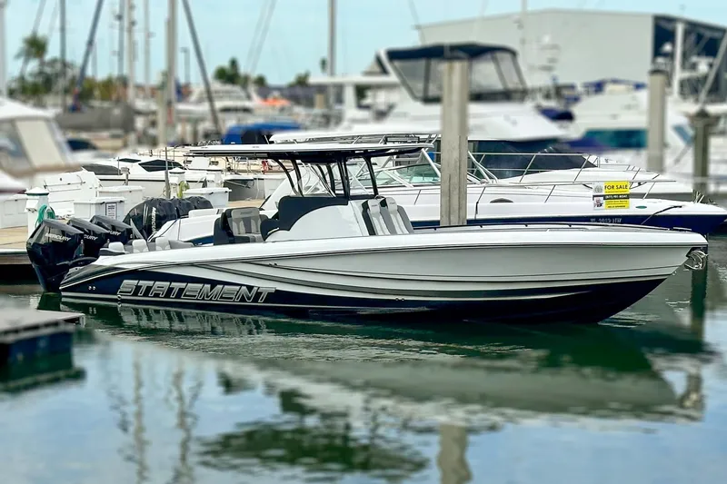 Slide: The Image of 2024 Statement 350 Open boat docked in marina, sleek design, powerful engines. - 3