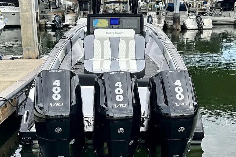 Slide: The Image of 2024 Statement 350 Open boat with triple Mercury 400 V10 engines docked at marina. - 4