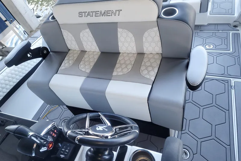 Slide: The Image of 2024 Statement 350 Open boat interior with stylish seating and modern steering wheel design. - 7