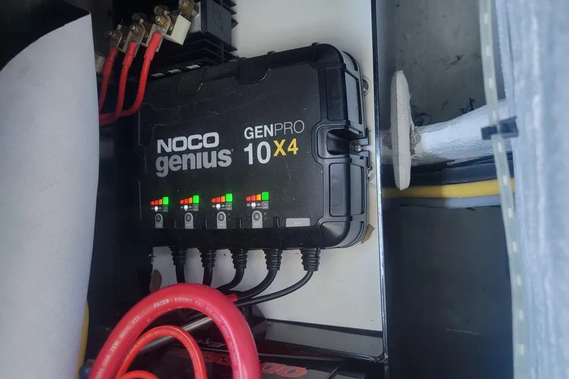 Slide: The Image of NOCO Genius GENPRO 10X4 charger in 2024 Statement 350 Open boat. - 9