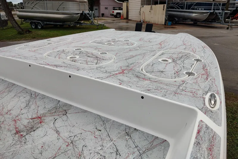 Slide: The Image of 2016 Fat Cat 21 boat deck with abstract red and black splatter design. - 12